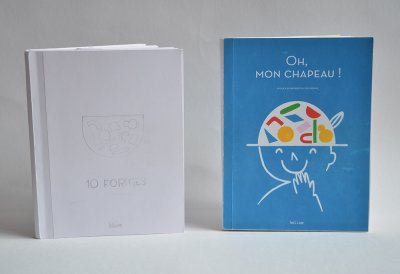 Troisième et quatrième projets de maquette du livre. Le format s'agrandit et le projet final se devine. Le titre apparaît.