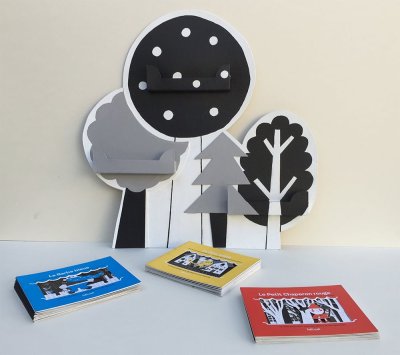 Porte-albums permettant de présenter les trois histoires ensemble.
